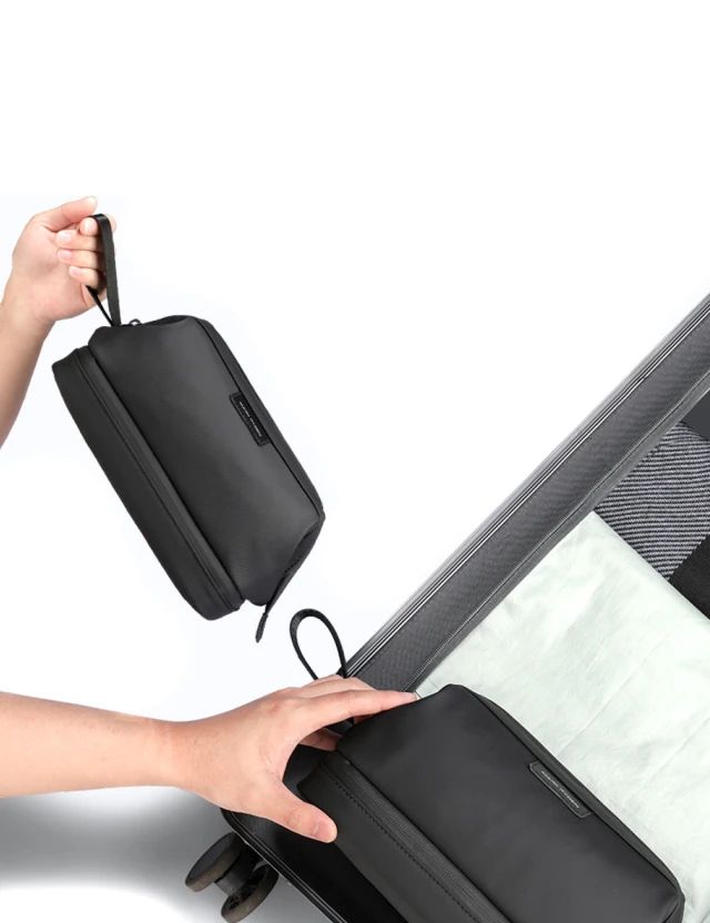 Mark Ryden Velo MR264 black — being placed into suitcase side pocket