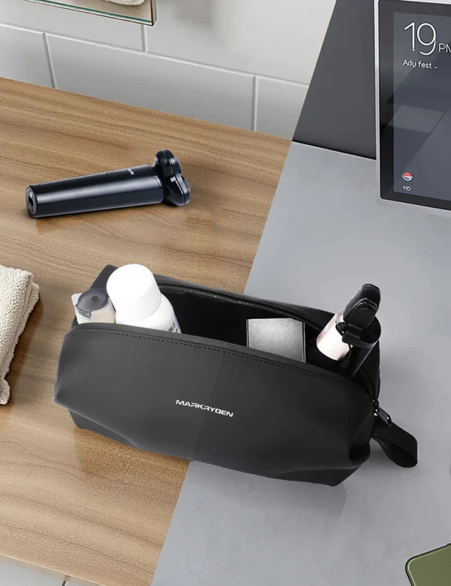 Lifestyle with items Mark Ryden Dexo MR35 toiletry bag — open with travel toiletries