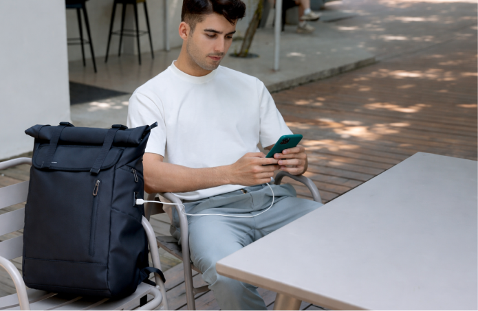 Traveller seated with backpack
