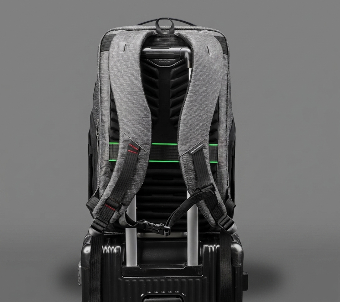 Traveller carrying a backpack with useful carry features